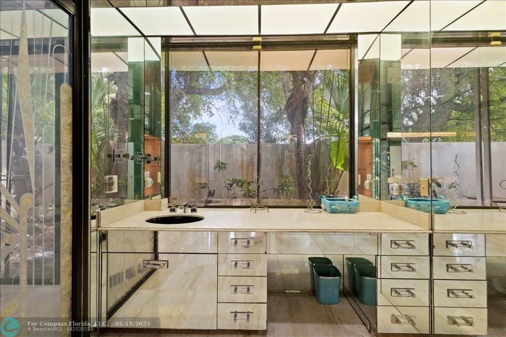 5304 Woodlands Boulevard Tamarac, FL 33319 - Photo 36 of 57 a bathroom with a sink and a mirror