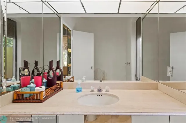 a living room with a couch and a ceiling fan