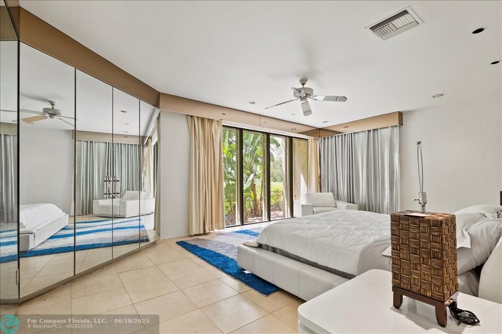 5304 Woodlands Boulevard Tamarac, FL 33319 - Photo 39 of 57 a bedroom with furniture and a window