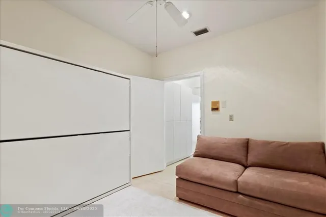 a bedroom with a large bed and a large window