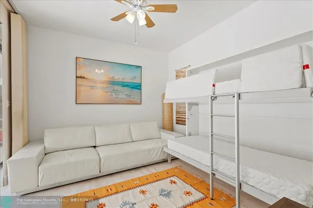 a room with pool table and next to a window