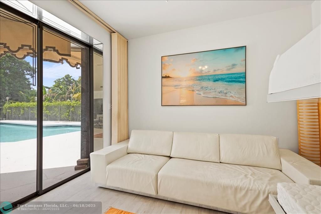 5304 Woodlands Boulevard Tamarac, FL 33319 - Photo 46 of 57 a bedroom with a large bed and a large window