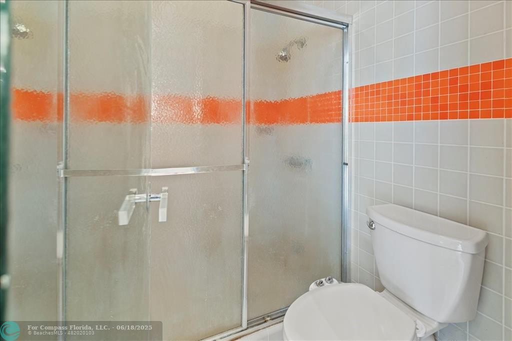 5304 Woodlands Boulevard Tamarac, FL 33319 - Photo 48 of 57 a bathroom with a toilet and a shower