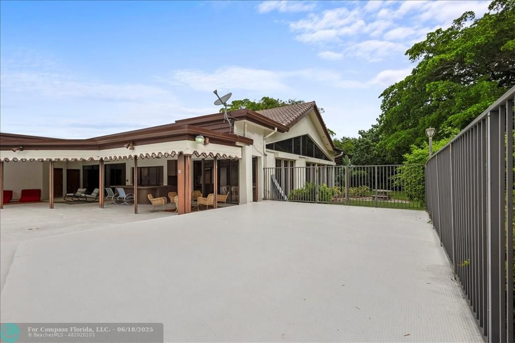 5304 Woodlands Boulevard Tamarac, FL 33319 - Photo 51 of 57 front view of a house with a porch