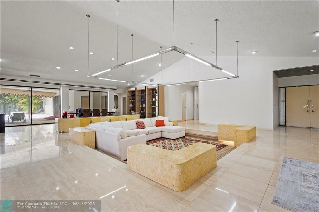 5304 Woodlands Boulevard Tamarac, FL 33319 - Photo 6 of 57 a living room with furniture and a large window