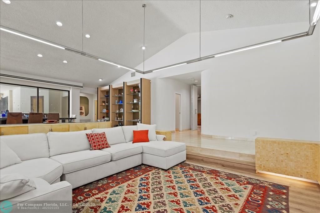 5304 Woodlands Boulevard Tamarac, FL 33319 - Photo 7 of 57 a living room with furniture and a rug