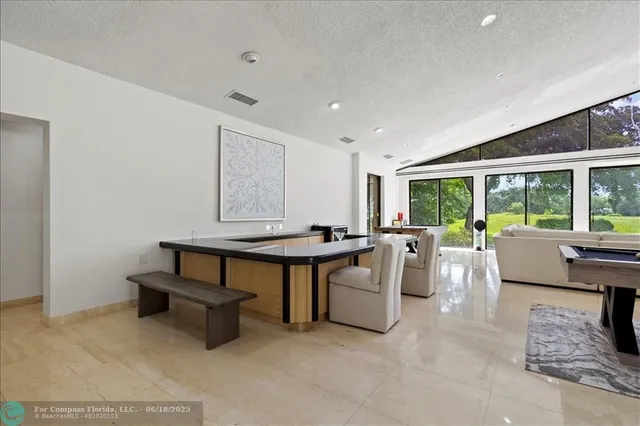 a living room with furniture a window and a table