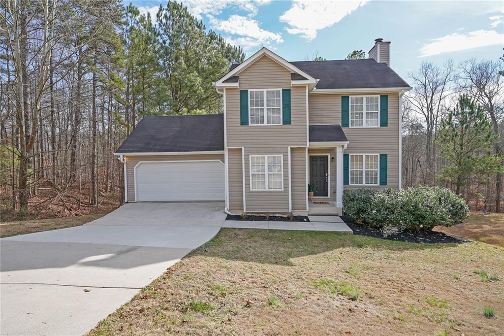 3530 Laurel Springs Cove Villa Rica, GA 30180 - Photo 1 of 1 a front view of a house with a yard