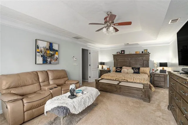 a bedroom with furniture and a chandelier