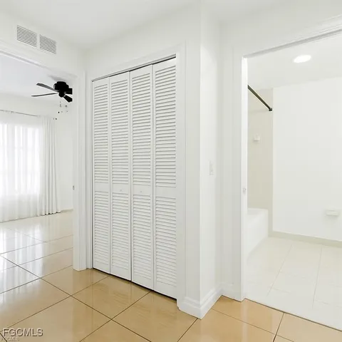 a bathroom with a toilet a sink and shower