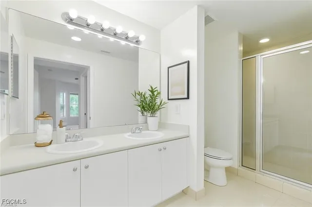 a bed room with a bed and a potted plant