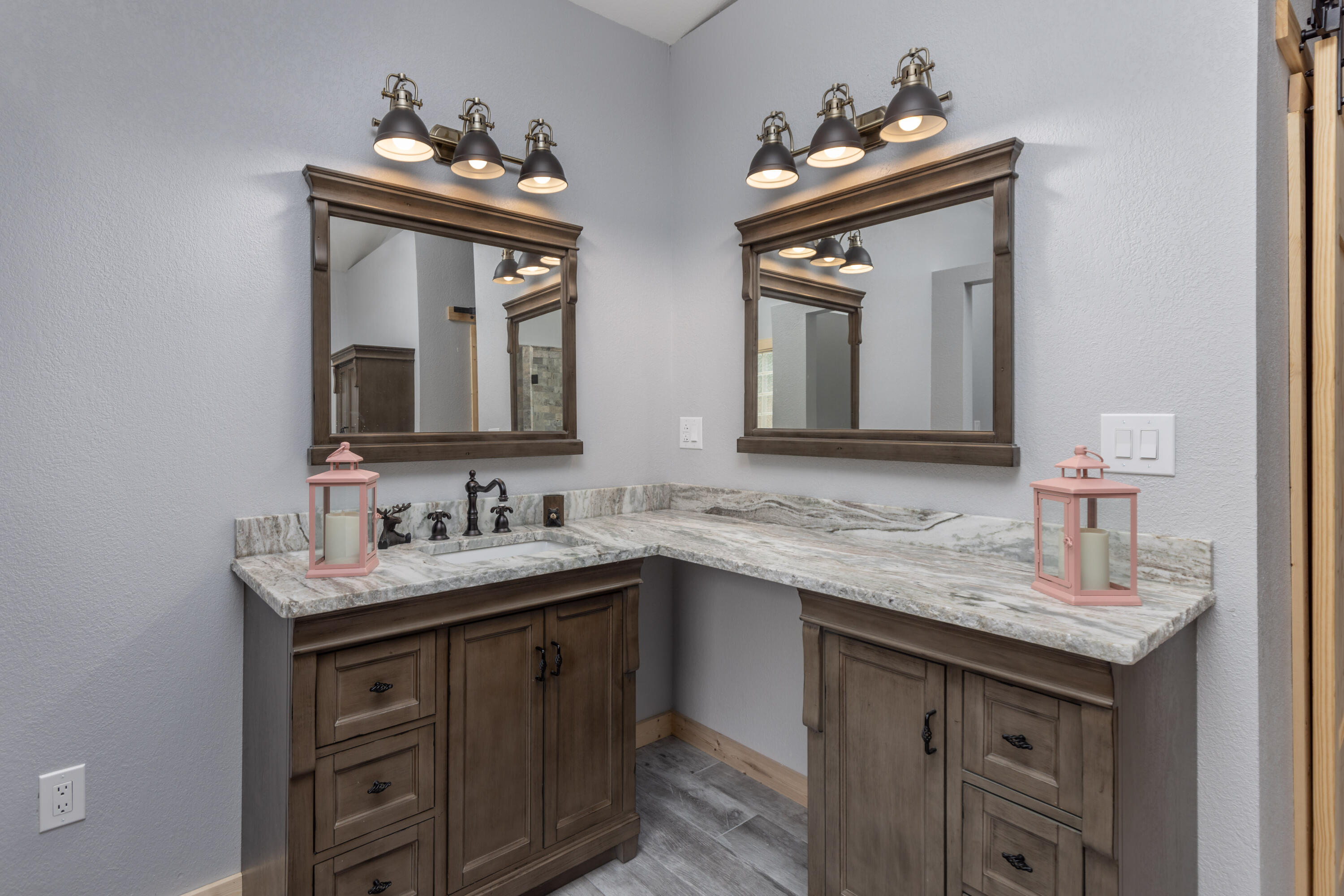 229 Madrid Road Cantonment, FL 32533 - Photo 14 of 84 a bathroom with double sink and two mirror