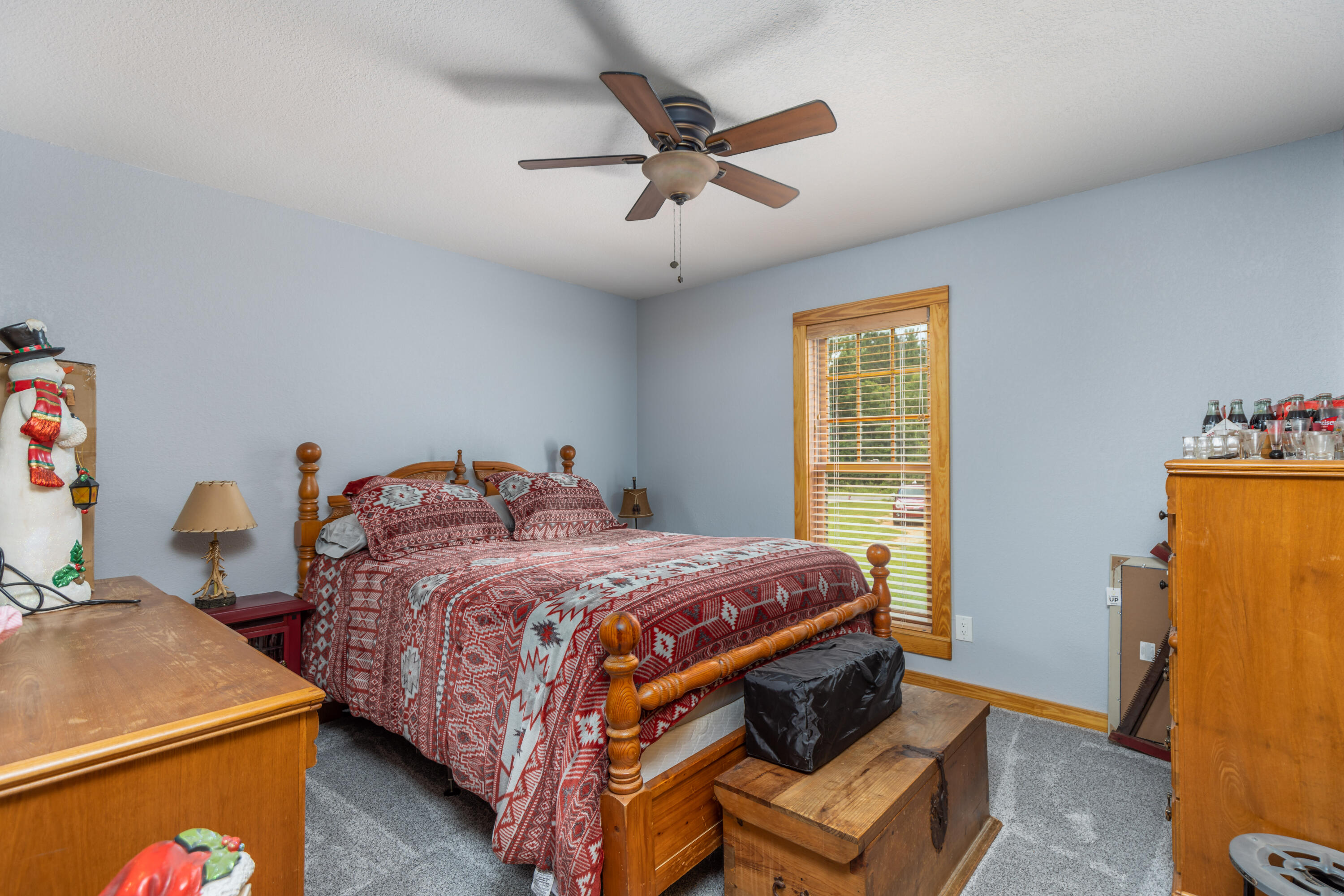 229 Madrid Road Cantonment, FL 32533 - Photo 16 of 84 a bedroom with a bed and a table
