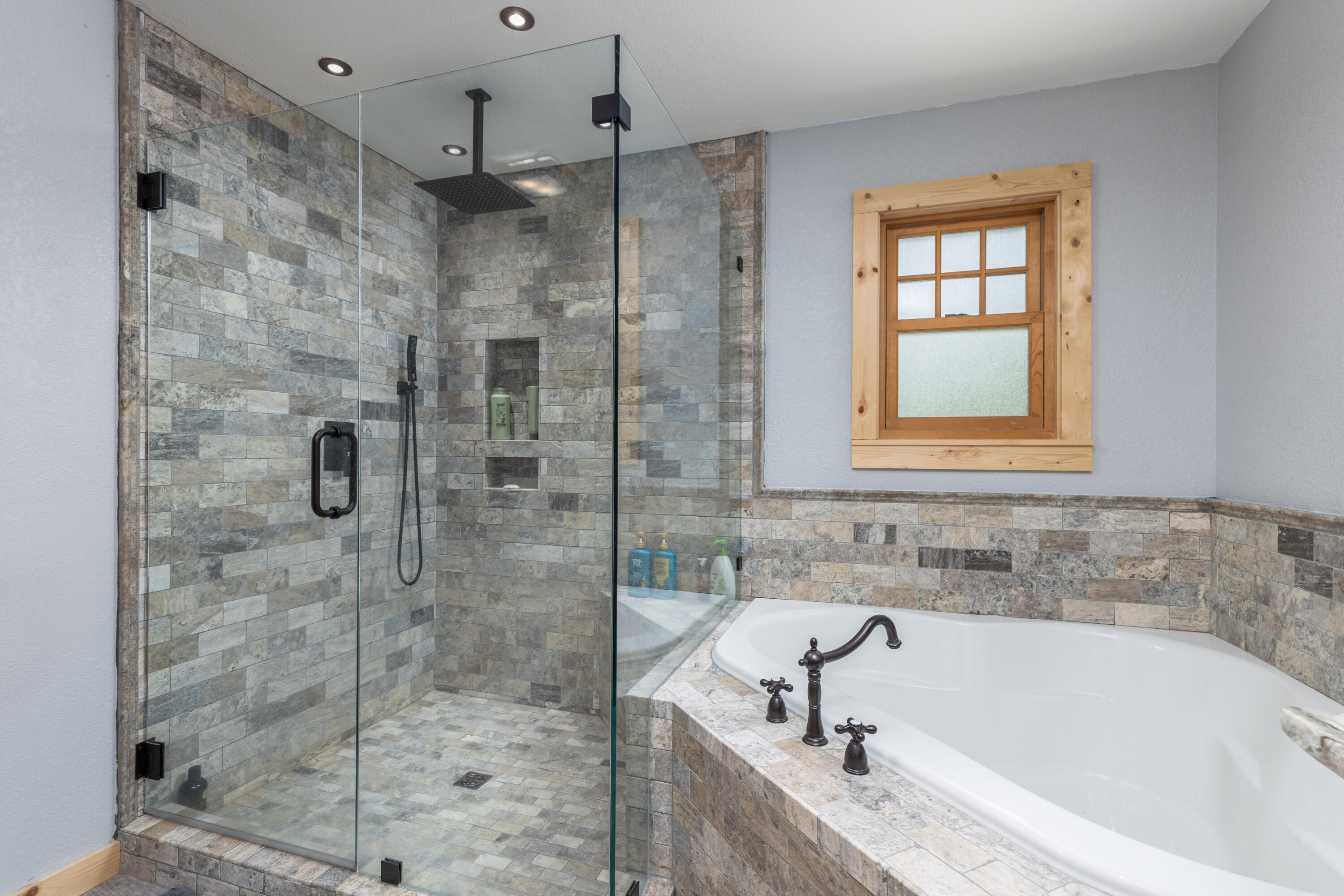 229 Madrid Road Cantonment, FL 32533 - Photo 19 of 84 a bathroom with a bathtub and shower