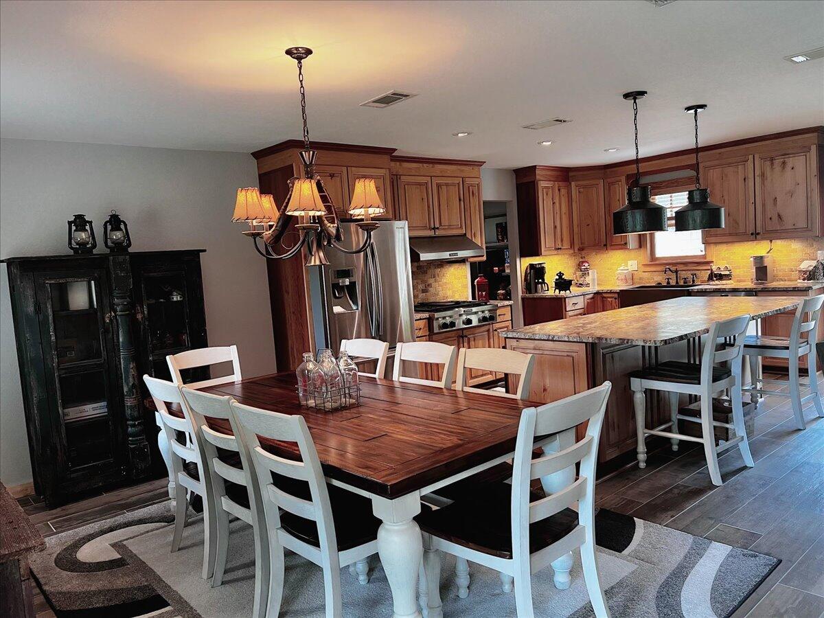 229 Madrid Road Cantonment, FL 32533 - Photo 23 of 84 a view of a dining room with furniture
