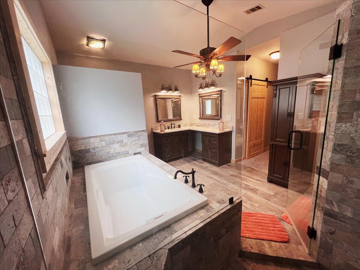 229 Madrid Road Cantonment, FL 32533 - Photo 50 of 84 a bathroom with a sink and a mirror