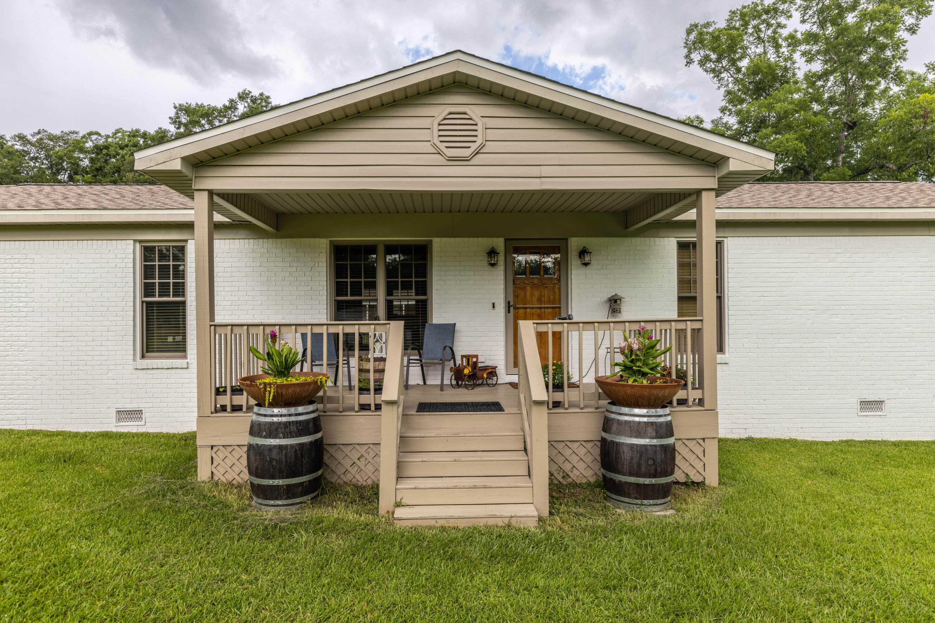 229 Madrid Road Cantonment, FL 32533 - Photo 58 of 84 a front view of a house with porch