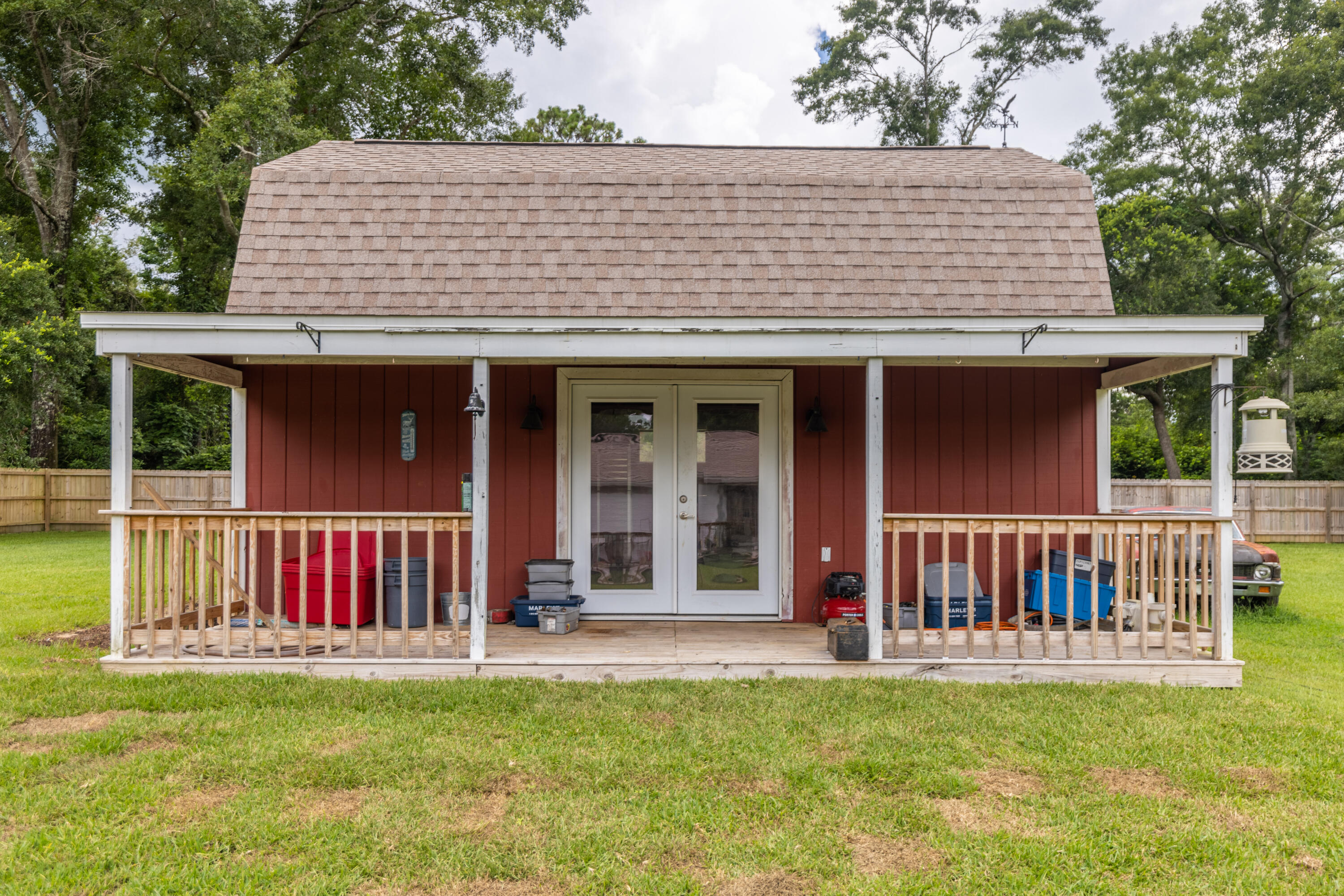 229 Madrid Road Cantonment, FL 32533 - Photo 60 of 84 a view of a house with a deck