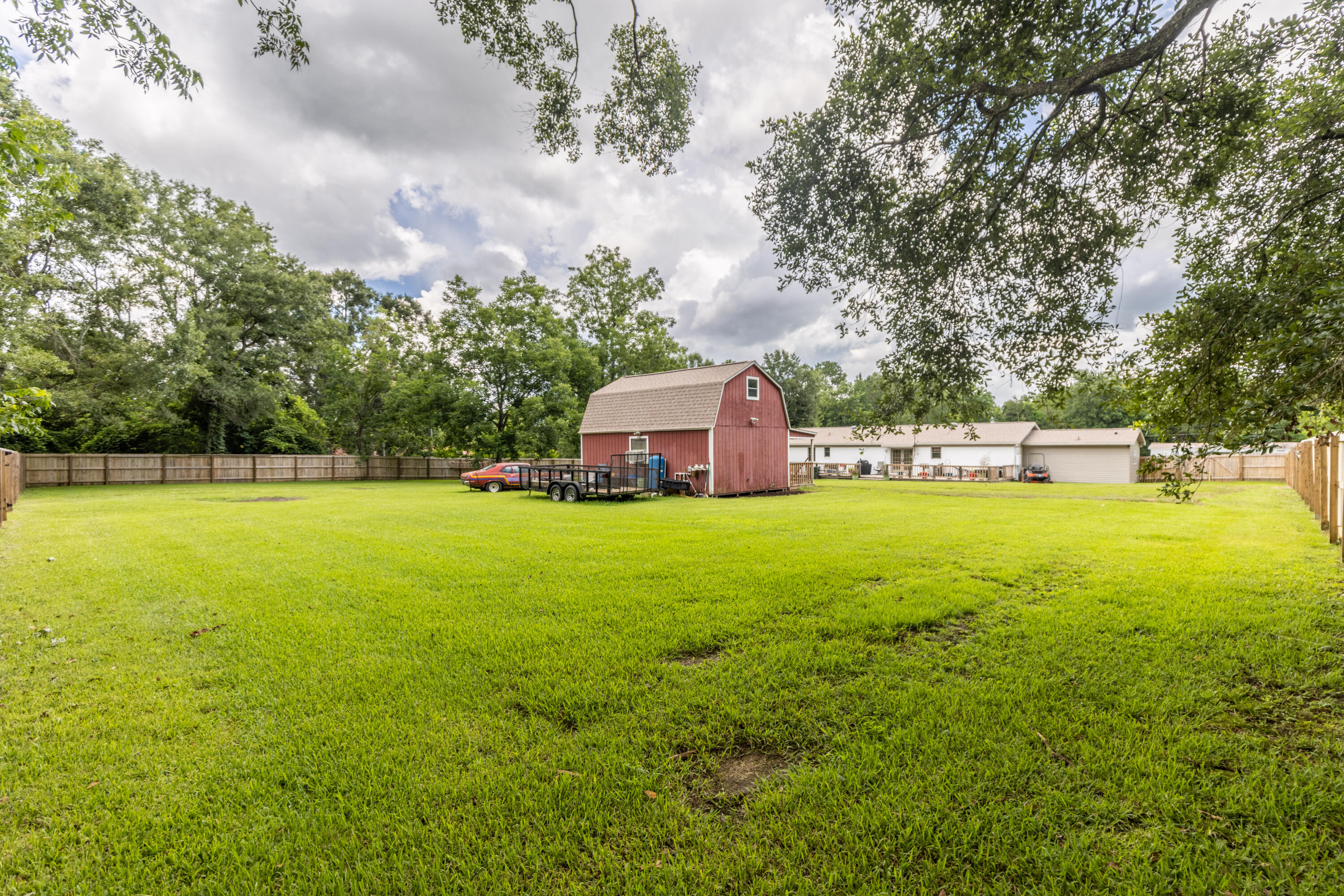 229 Madrid Road Cantonment, FL 32533 - Photo 65 of 84 a house view with swimming pool in front of it