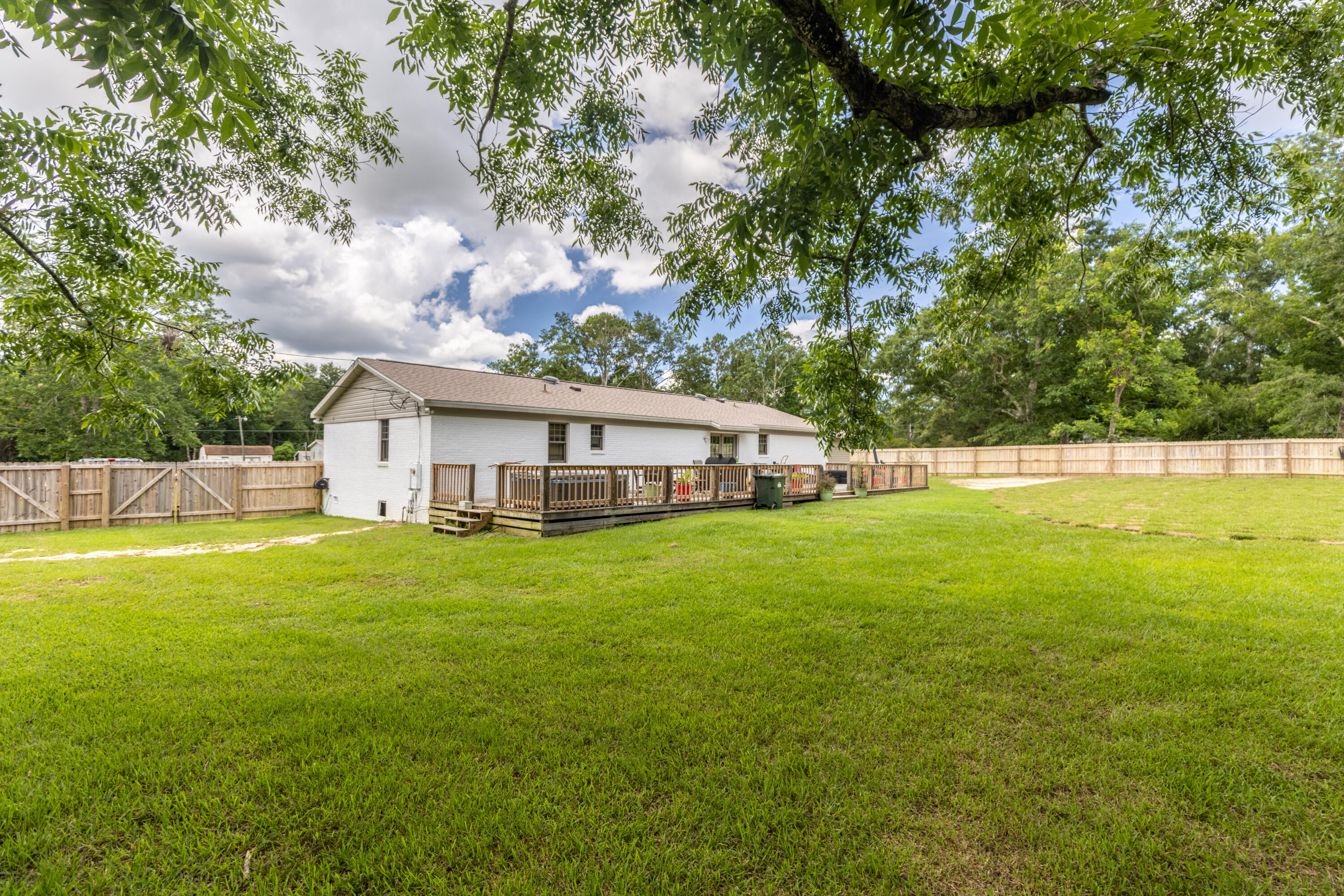 229 Madrid Road Cantonment, FL 32533 - Photo 67 of 84 a view of a house with a backyard