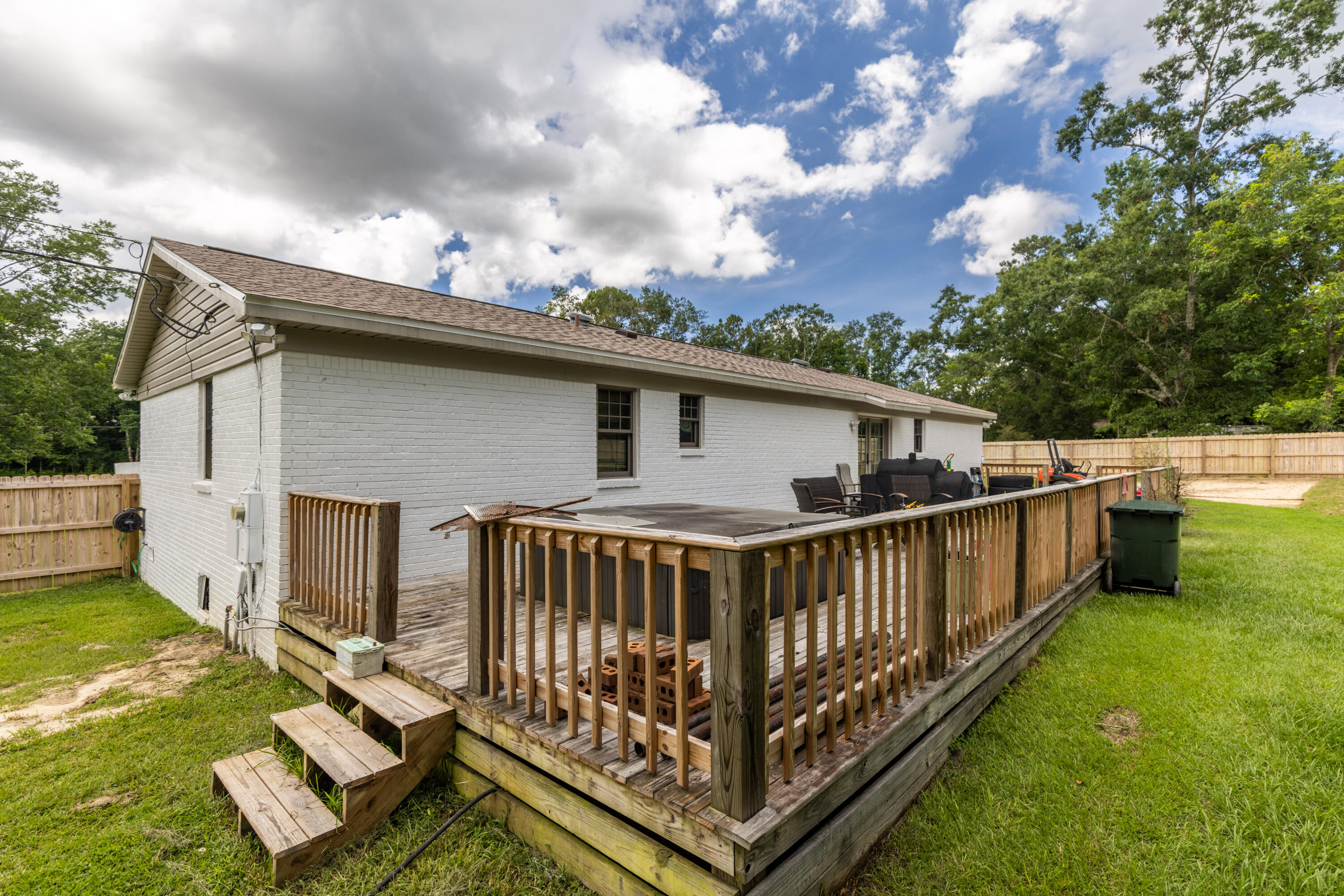 229 Madrid Road Cantonment, FL 32533 - Photo 68 of 84 a view of a house with backyard and deck