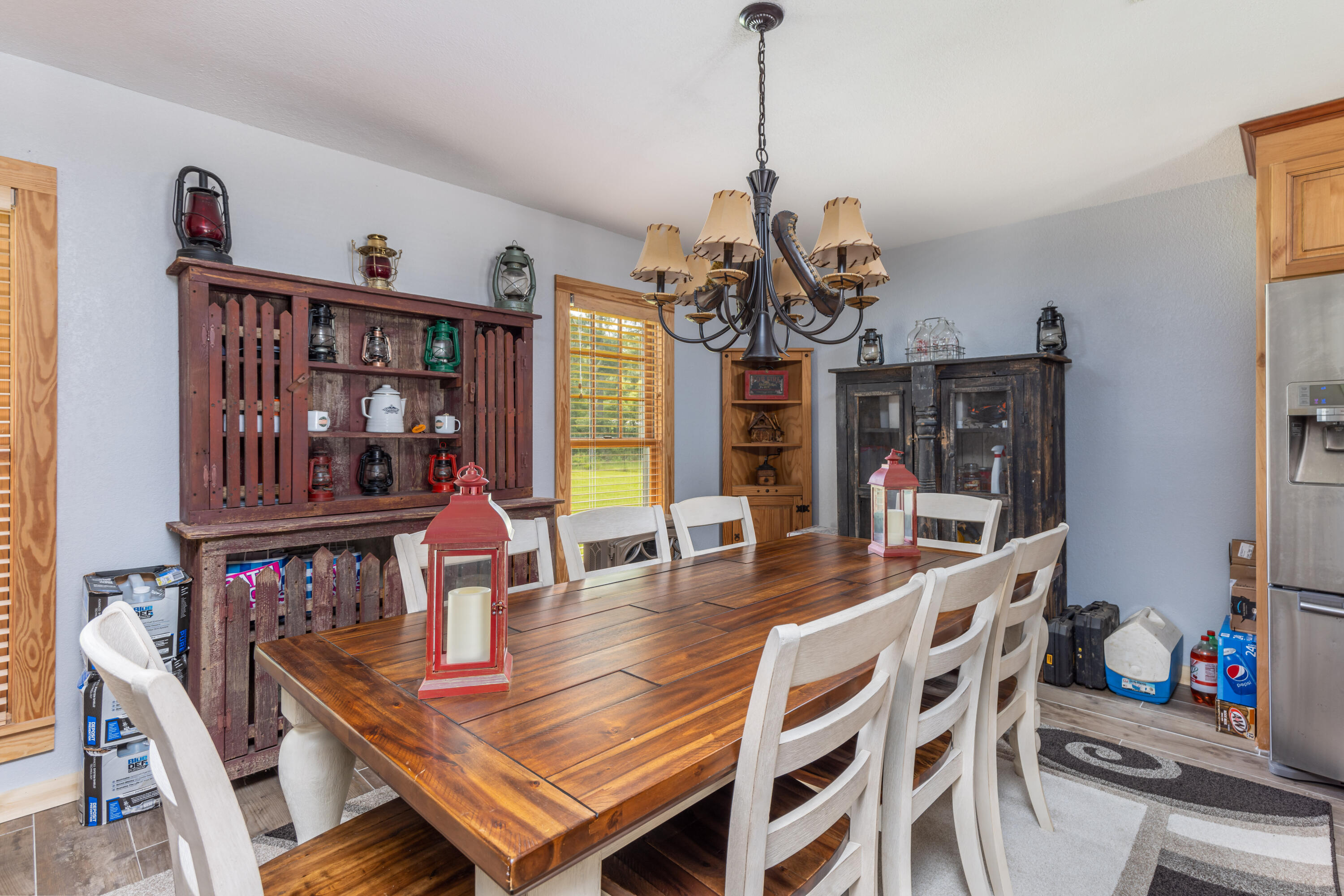 229 Madrid Road Cantonment, FL 32533 - Photo 7 of 84 a view of a dining room with furniture a chandelier and wooden floor