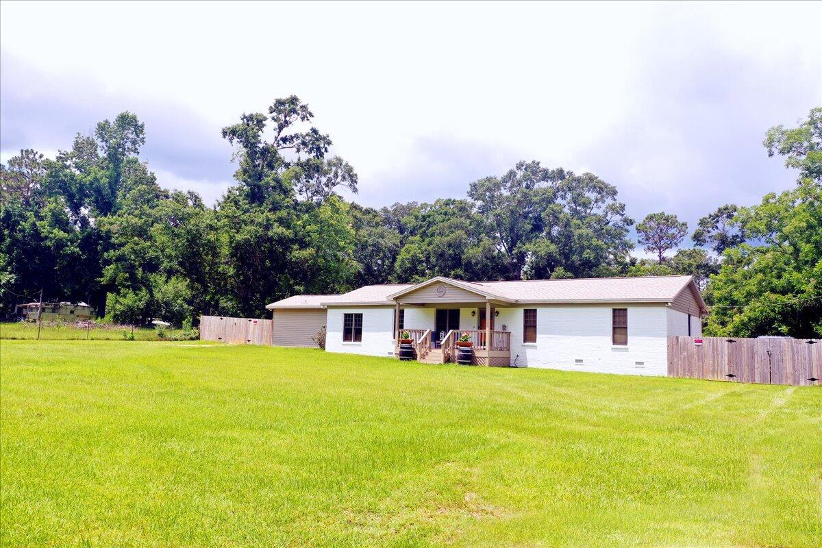 229 Madrid Road Cantonment, FL 32533 - Photo 73 of 84 a view of a house with a big yard
