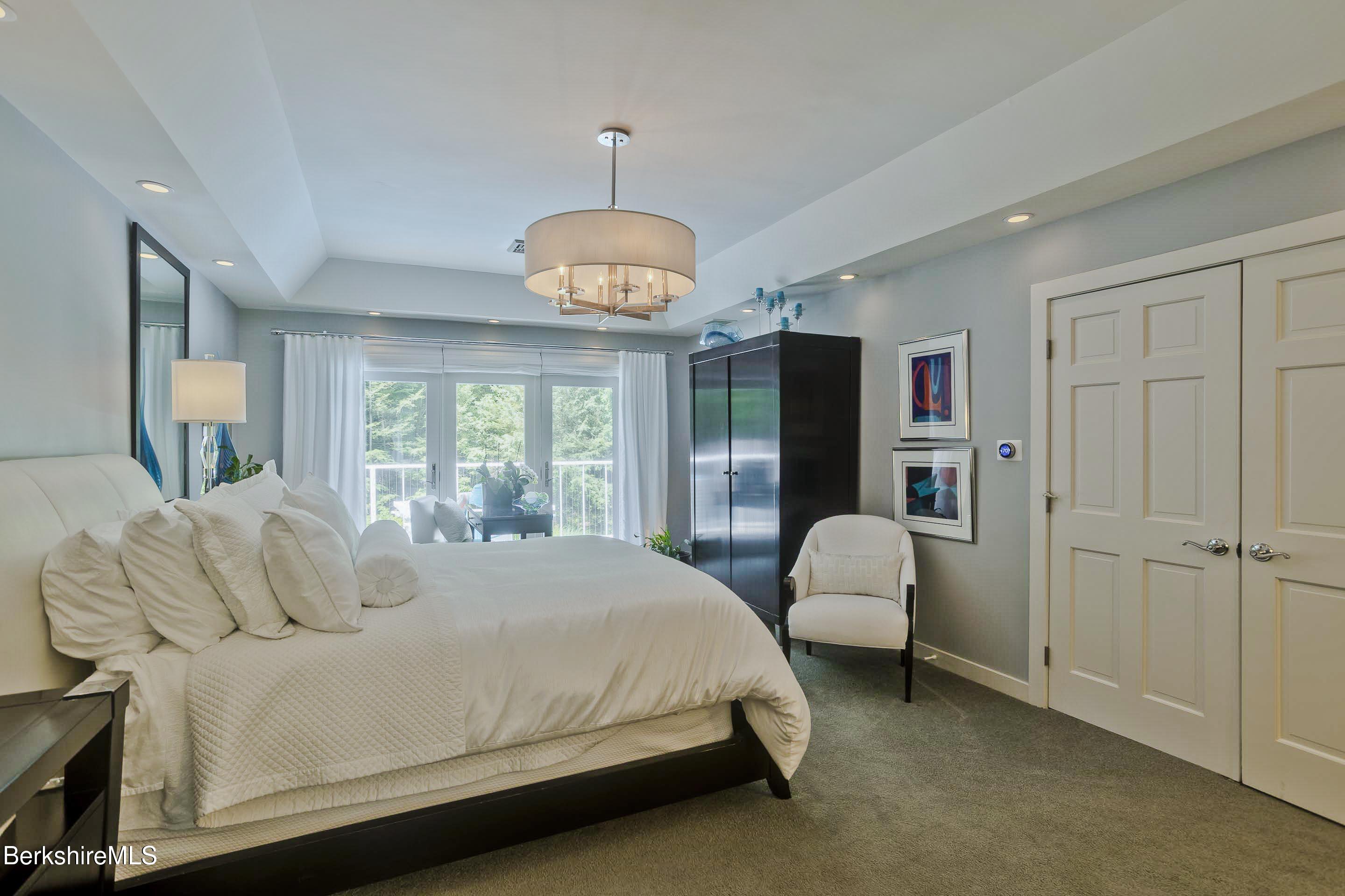 183 Loomis Ridge Road Westfield, MA 01085 - Photo 22 of 39 a bedroom with a bed chandelier and a window