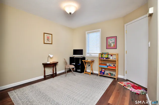 a bedroom with bed and a chandelier