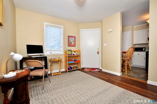 a bedroom with furniture and a window