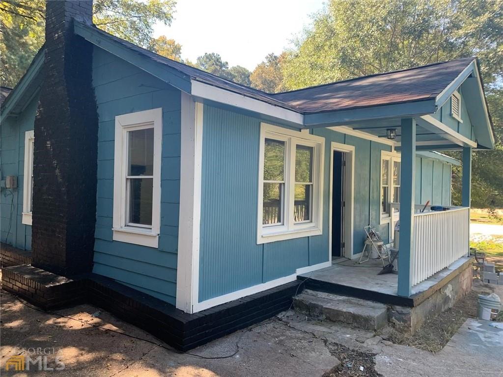 116 Edwards Street Bremen, GA 30110 - Photo 2 of 33 a view of house with backyard and glass windows