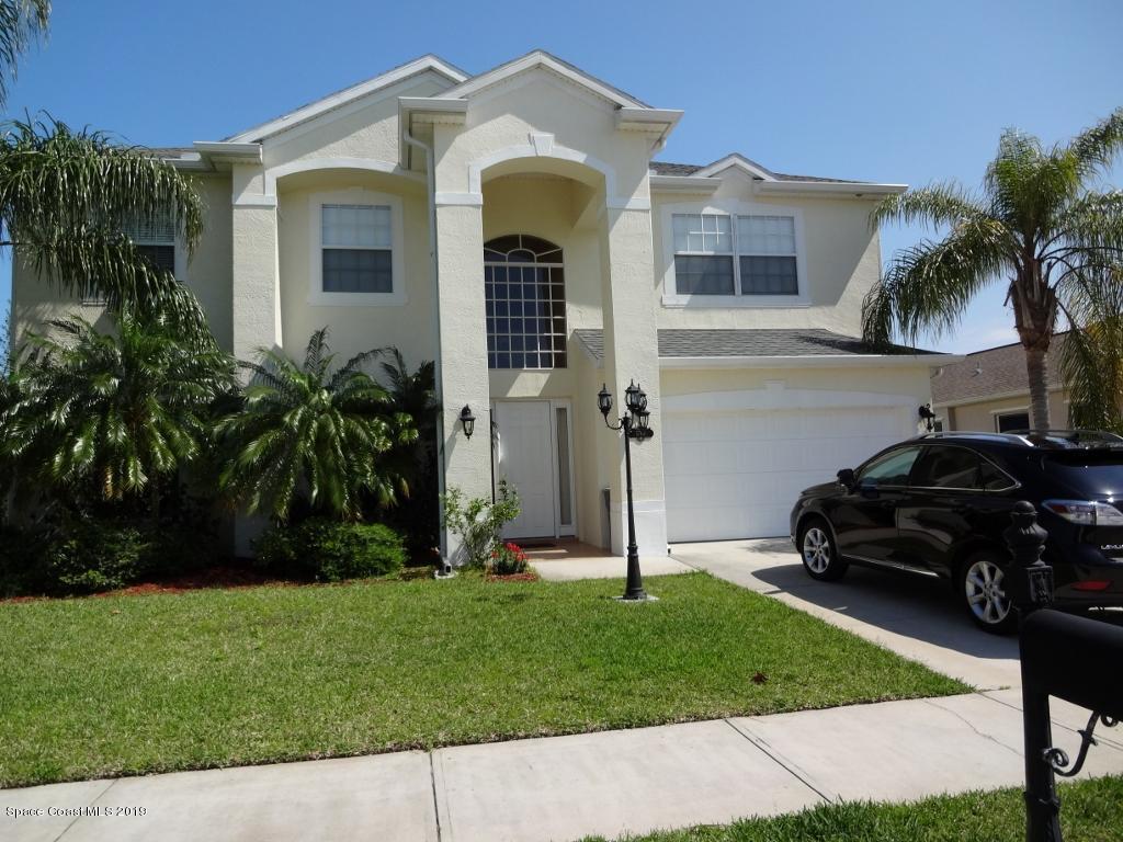 3763 Stream Drive Melbourne, FL 32940 - Photo 2 of 6 a front view of a house with a garden