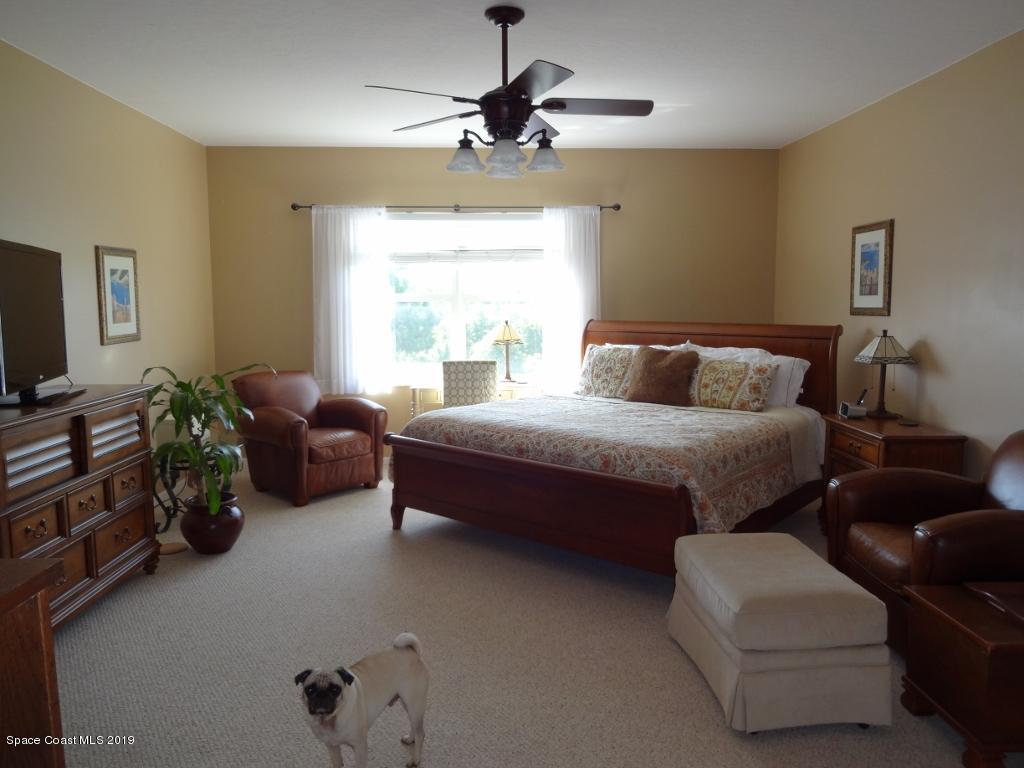 3763 Stream Drive Melbourne, FL 32940 - Photo 4 of 6 a bedroom with furniture and a window