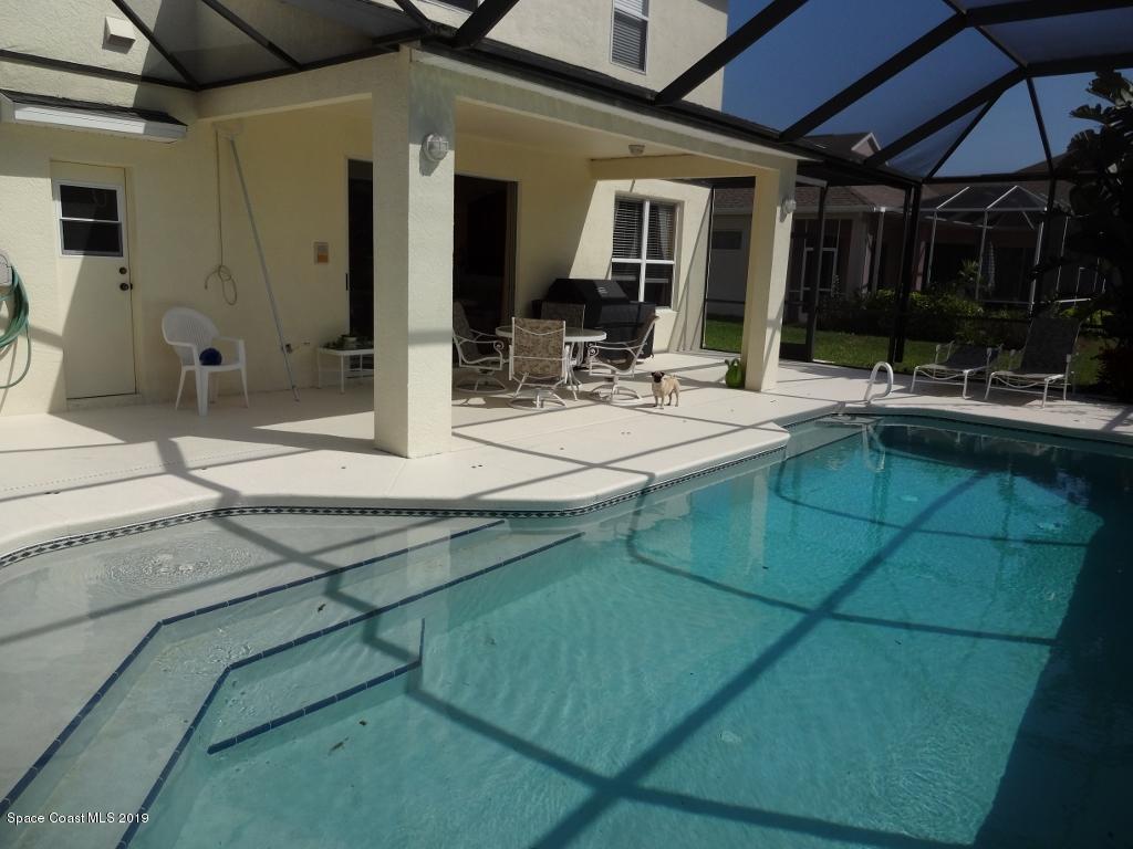 3763 Stream Drive Melbourne, FL 32940 - Photo 6 of 6 a view of a kitchen with kitchen island a sink and a stove top oven