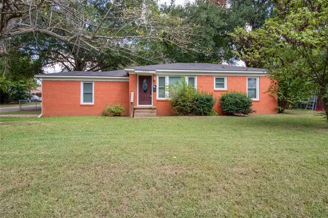 front view of a house with yard
