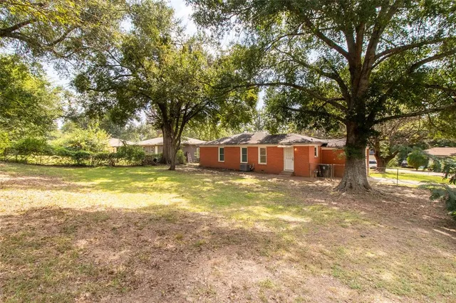 a view of a house with swimming pool