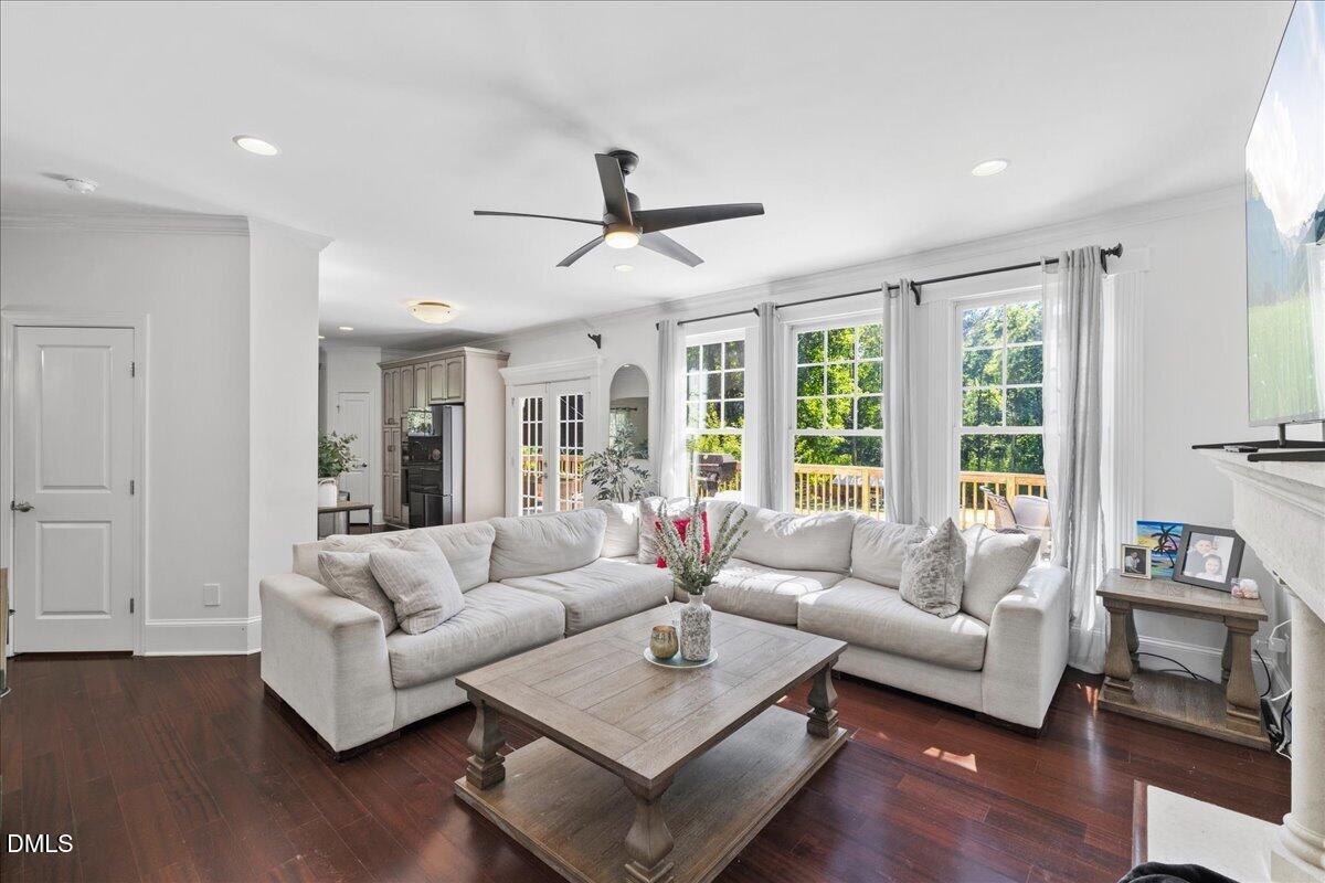 1304 Flying Hawk Road Apex, NC 27523 - Photo 17 of 52 a living room with furniture and a large window