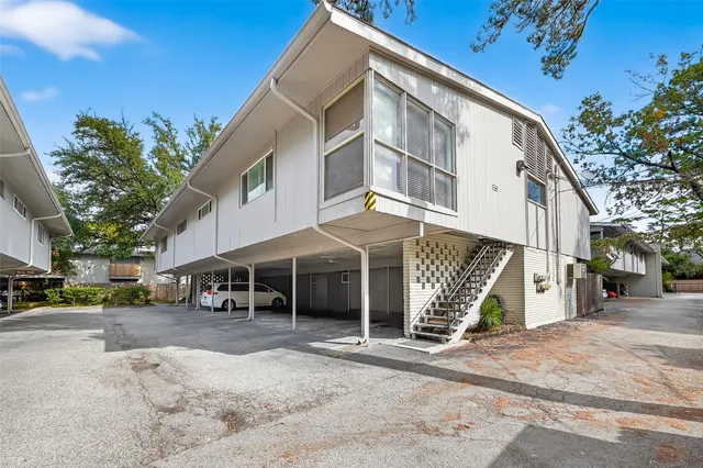 a view of a house with a yard and garage