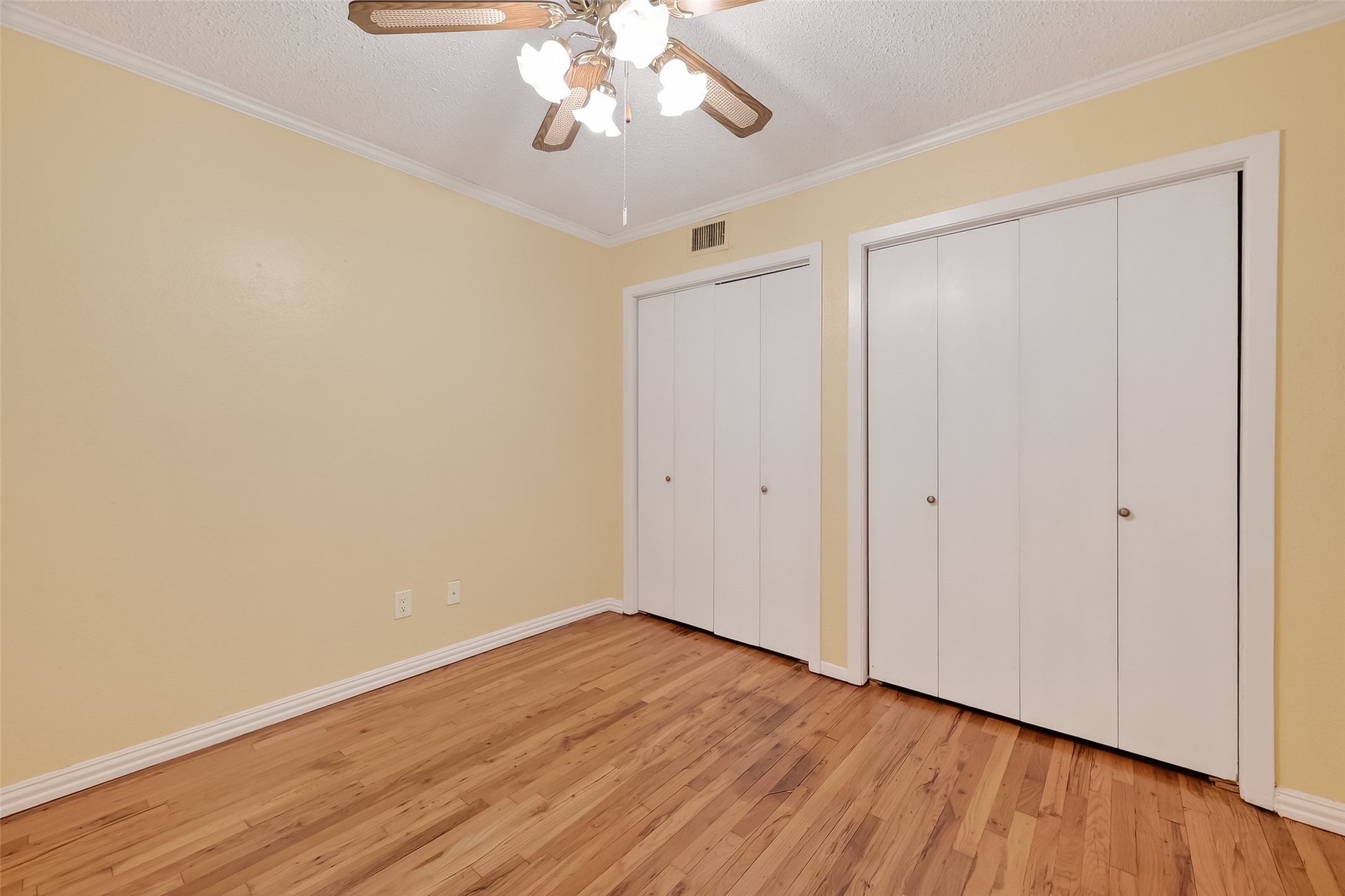 909 Silber Road, Unit 16C Houston, TX 77024 - Photo 25 of 32 a view of an empty room with wooden floor and a window