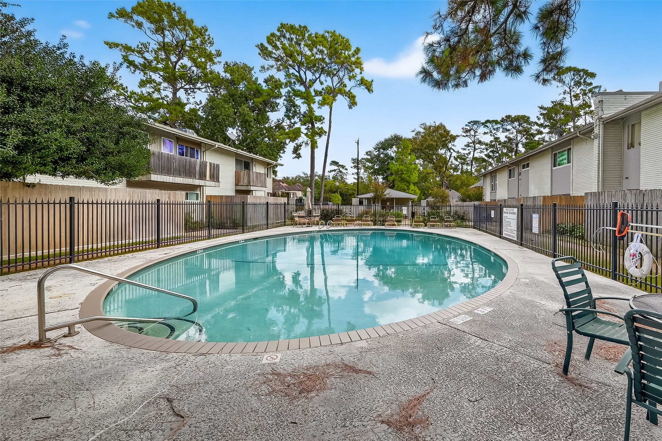 909 Silber Road, Unit 16C Houston, TX 77024 - Photo 30 of 32 a view of a swimming pool with a patio