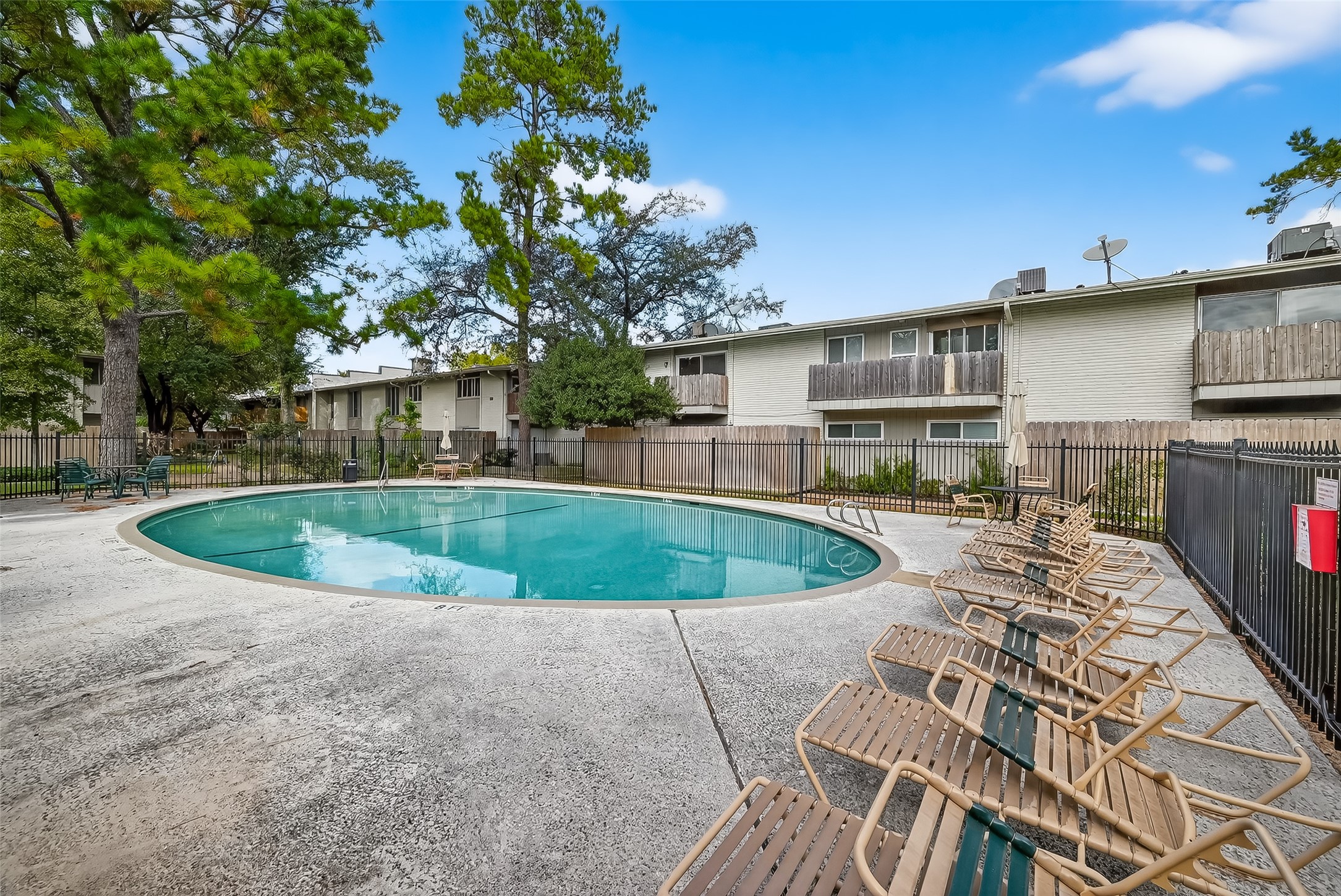 909 Silber Road, Unit 16C Houston, TX 77024 - Photo 32 of 32 a view of outdoor space yard and swimming pool