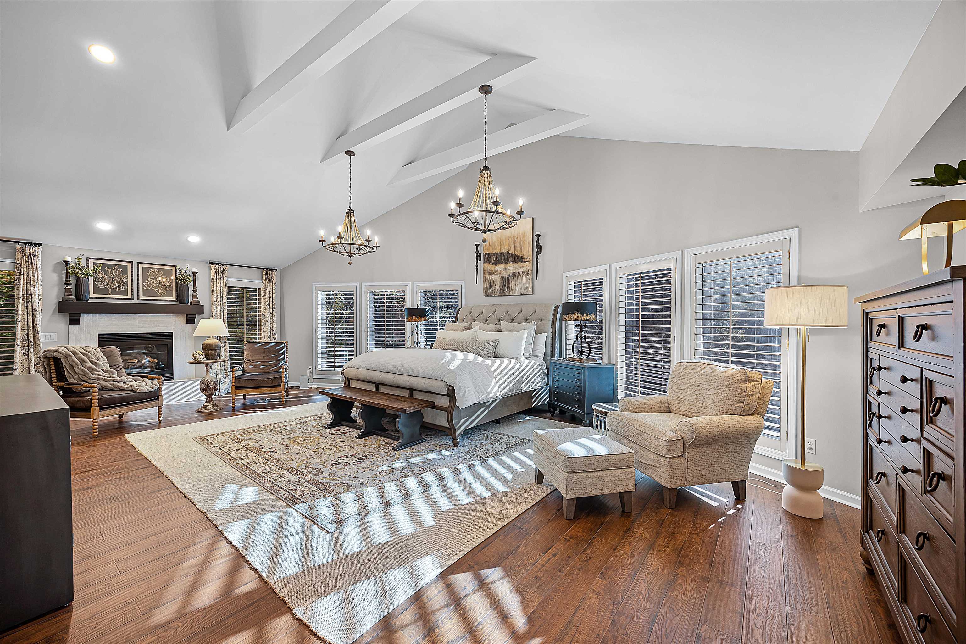 195 Ridge View Savannah, TN 38372 - Photo 17 of 40 a spacious bedroom with a bed a couch and a chandelier