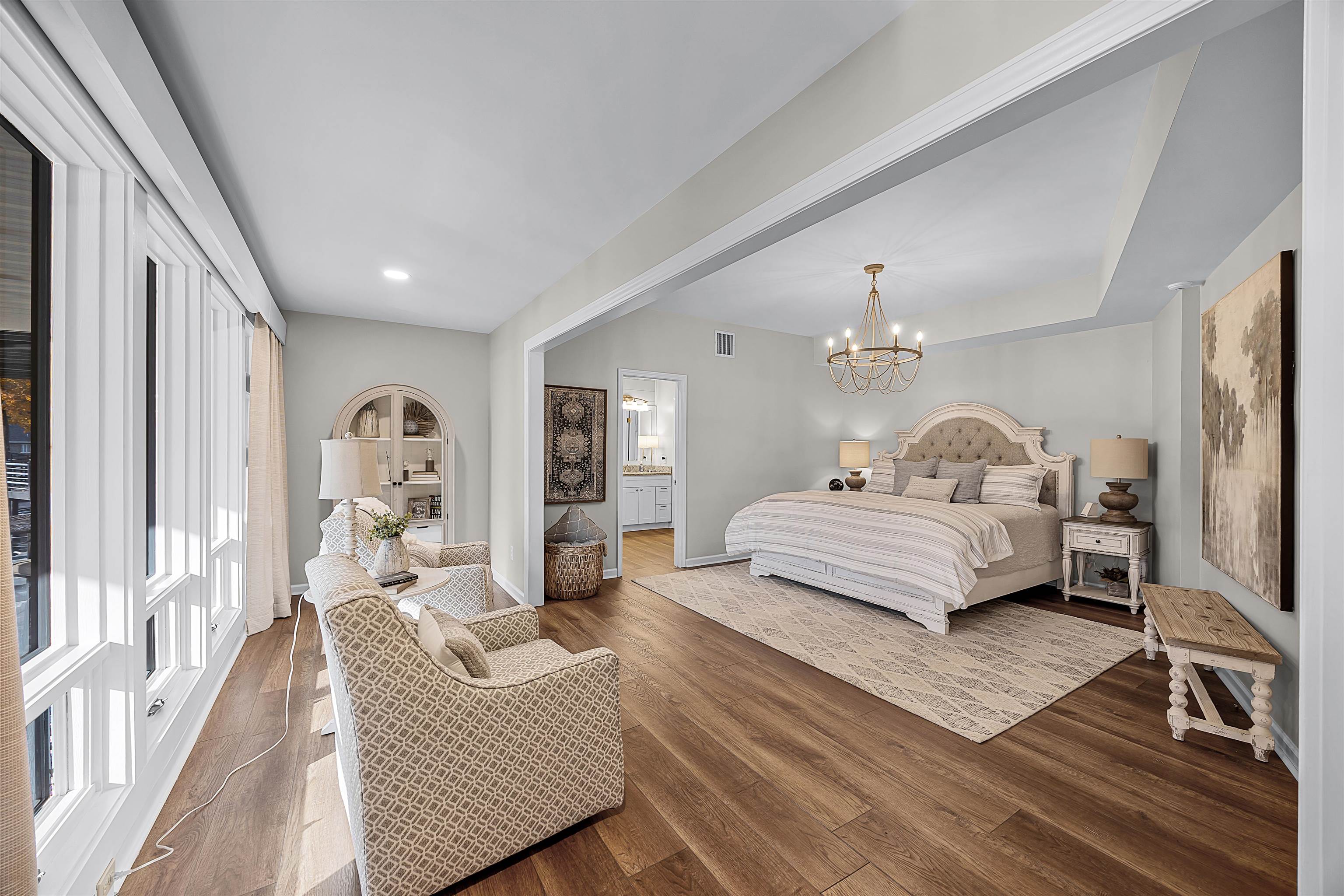195 Ridge View Savannah, TN 38372 - Photo 22 of 40 a bedroom with furniture and a chandelier