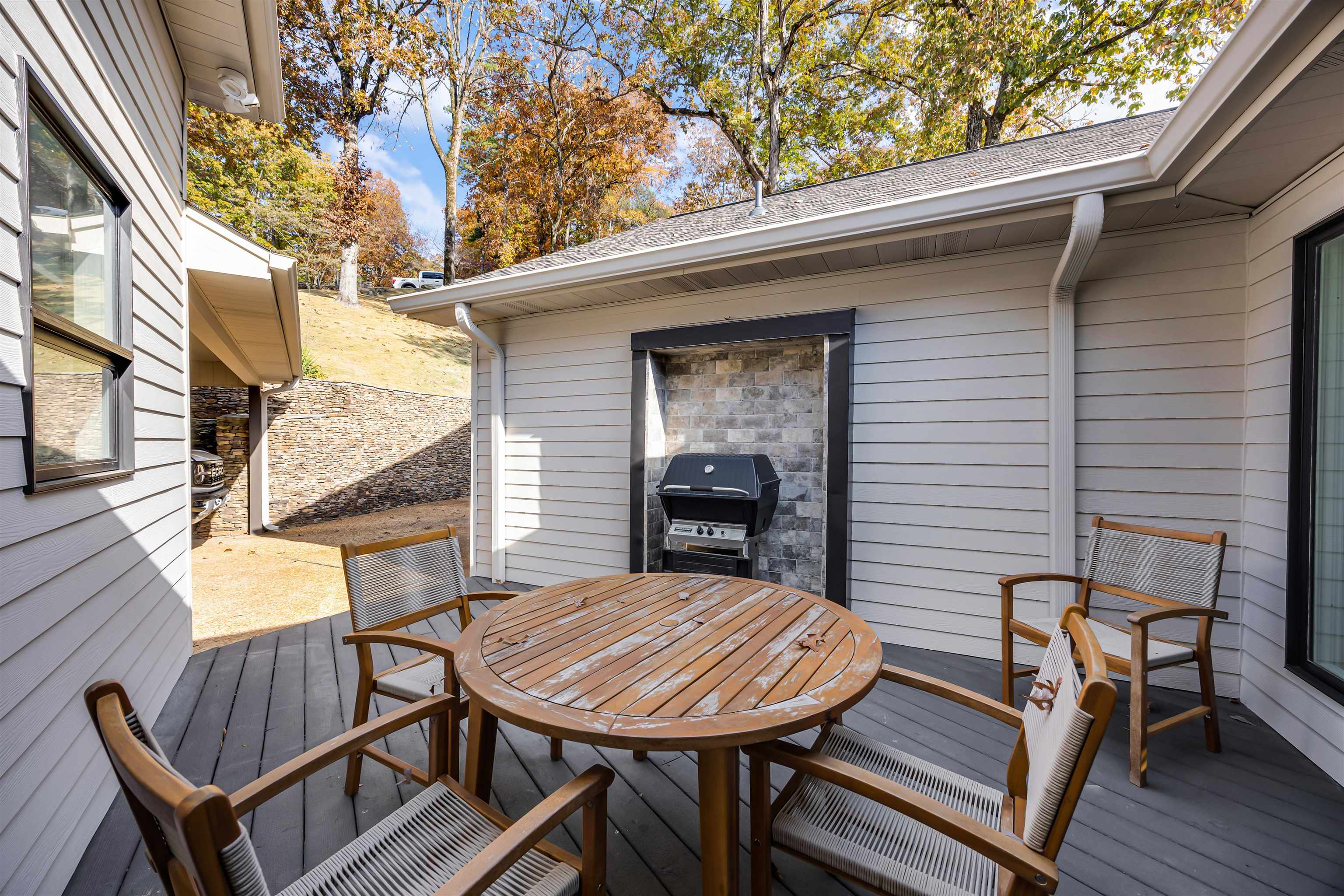 195 Ridge View Savannah, TN 38372 - Photo 33 of 40 a view of a patio with table and chairs with wooden floor and fence