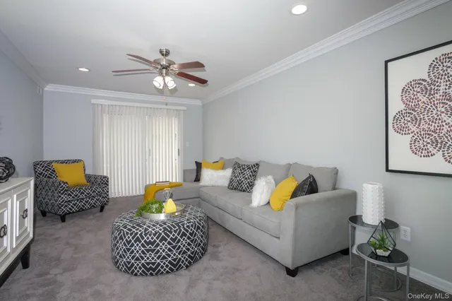 a living room with furniture and a lamp