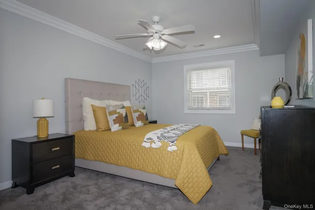 a bedroom with a bed and window with lamp