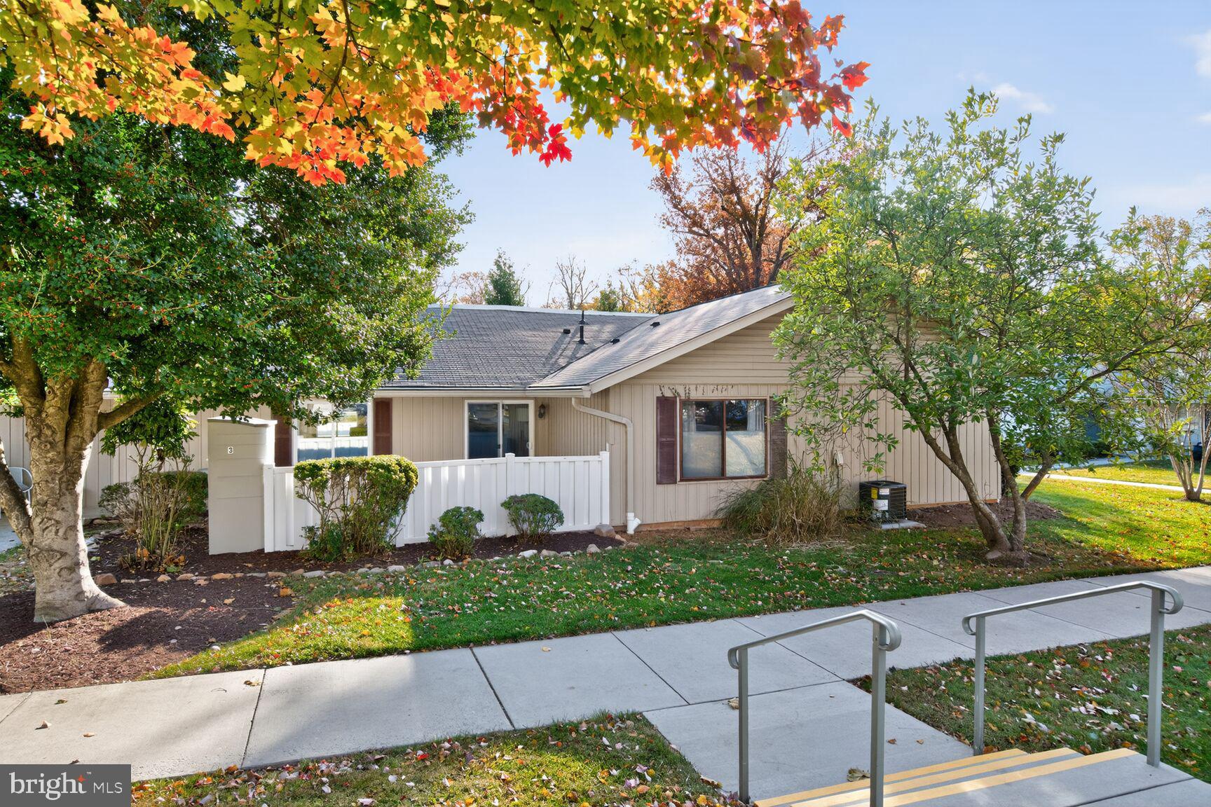 3110 Adderley Court, Unit 245A Silver Spring, MD 20906 - Photo 2 of 31 a front view of a house with a yard