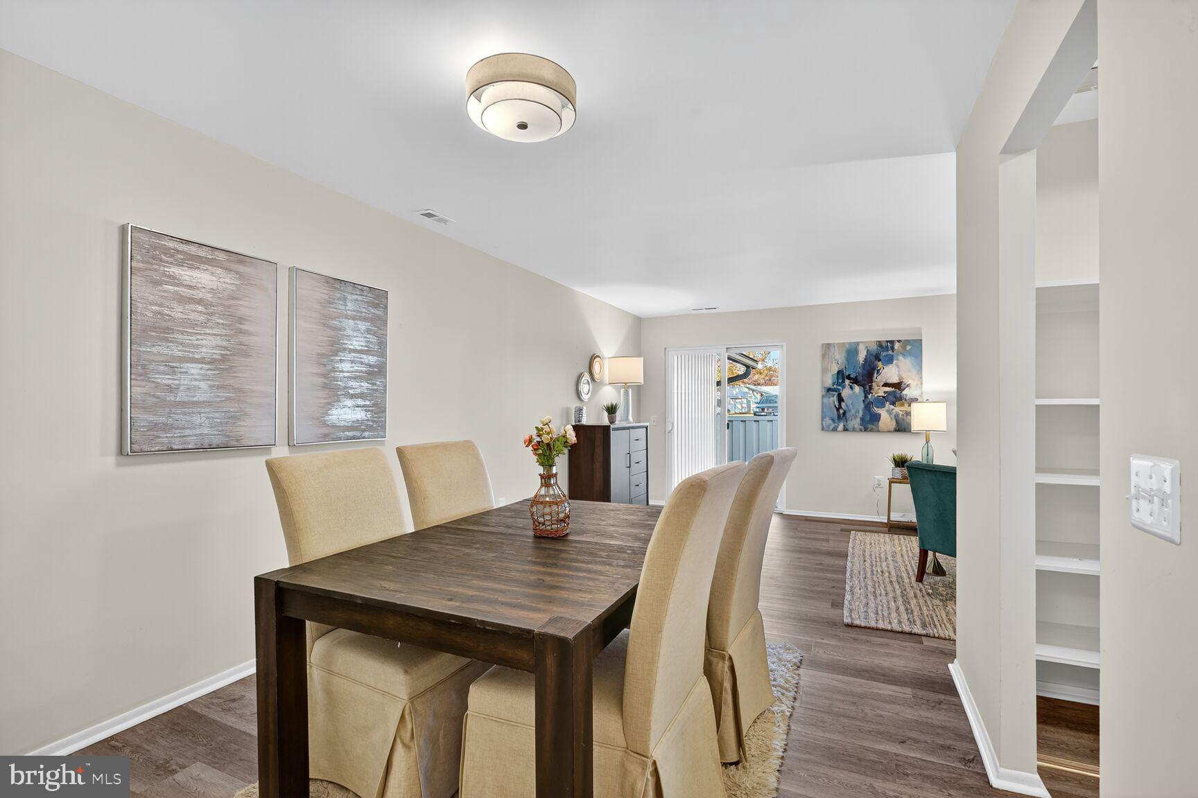 3110 Adderley Court, Unit 245A Silver Spring, MD 20906 - Photo 8 of 31 a view of a dining room with furniture and wooden floor