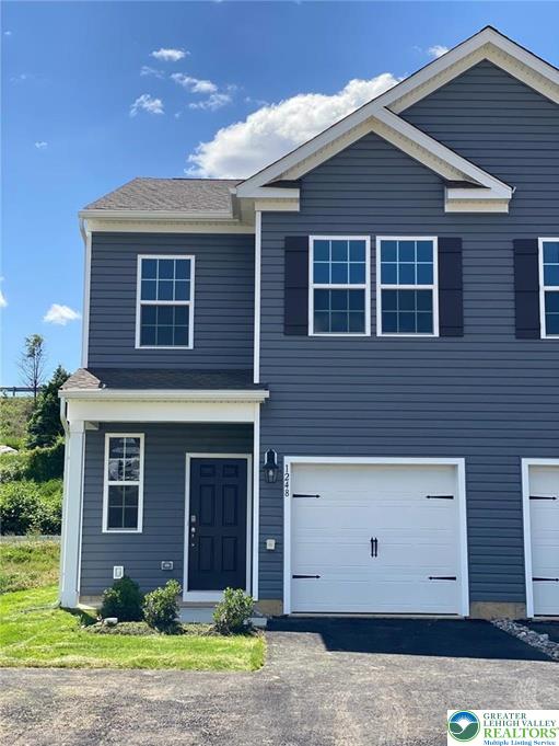 1248 Martin Road Breinigsville, PA 18031 - Photo 1 of 37 a front view of a house with a yard and garage