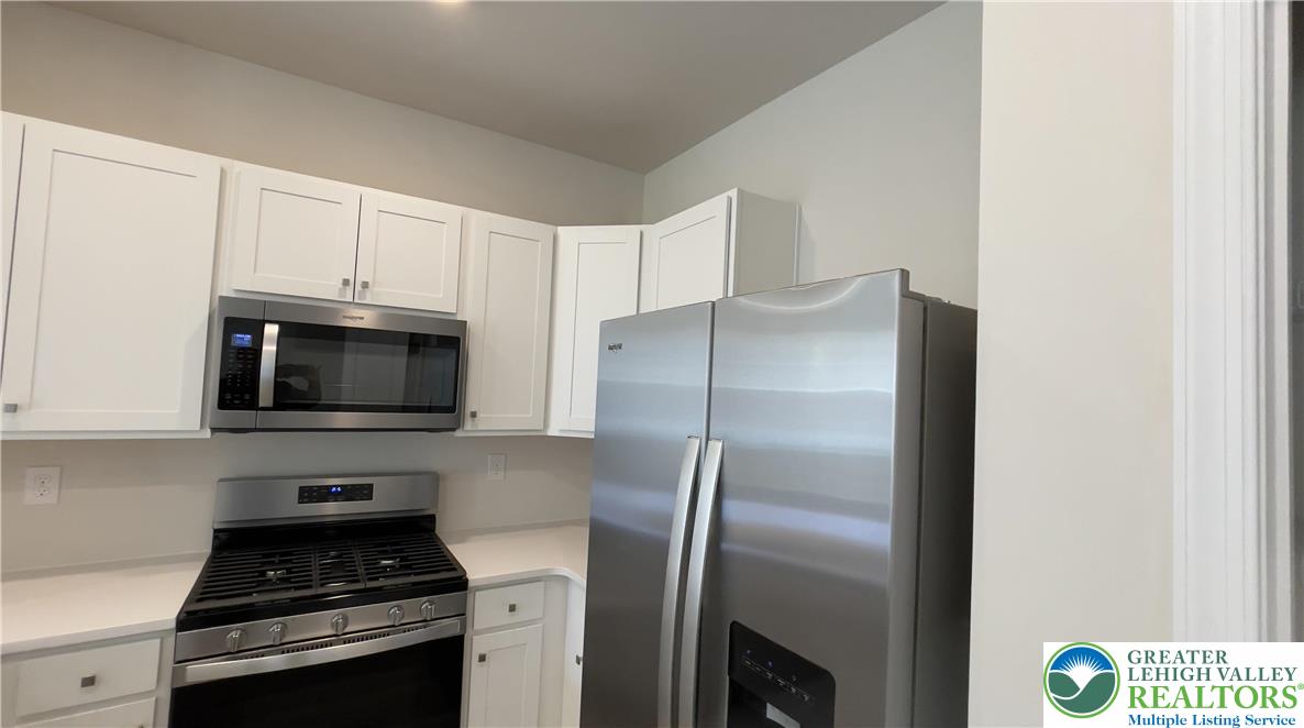 1248 Martin Road Breinigsville, PA 18031 - Photo 17 of 37 a kitchen with a refrigerator stove and microwave